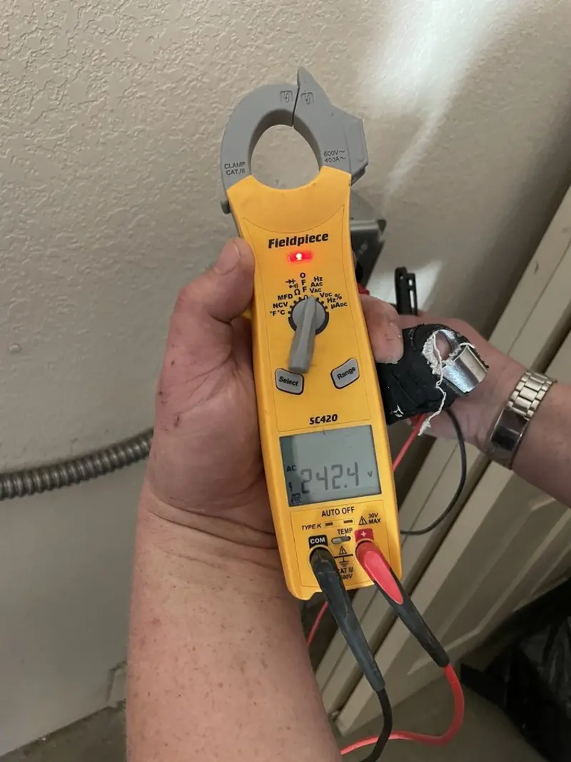 Voltage testing with clamp meter during Outlet Installation in South Bradenton